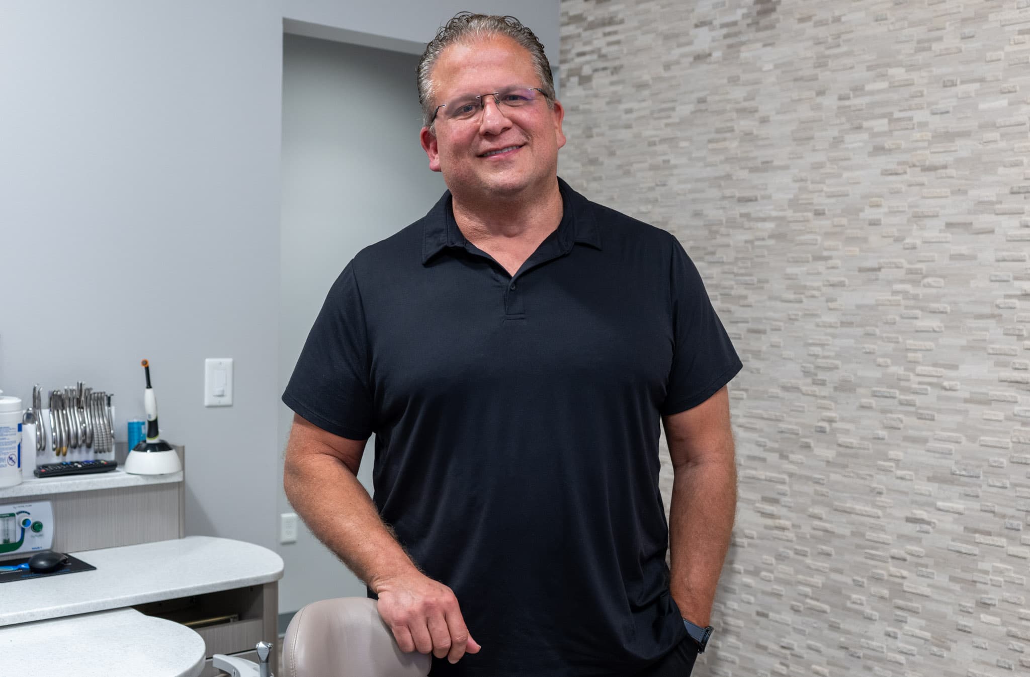 Dr. Stephen Deal in an operatory at Symmetry Modern Dentistry